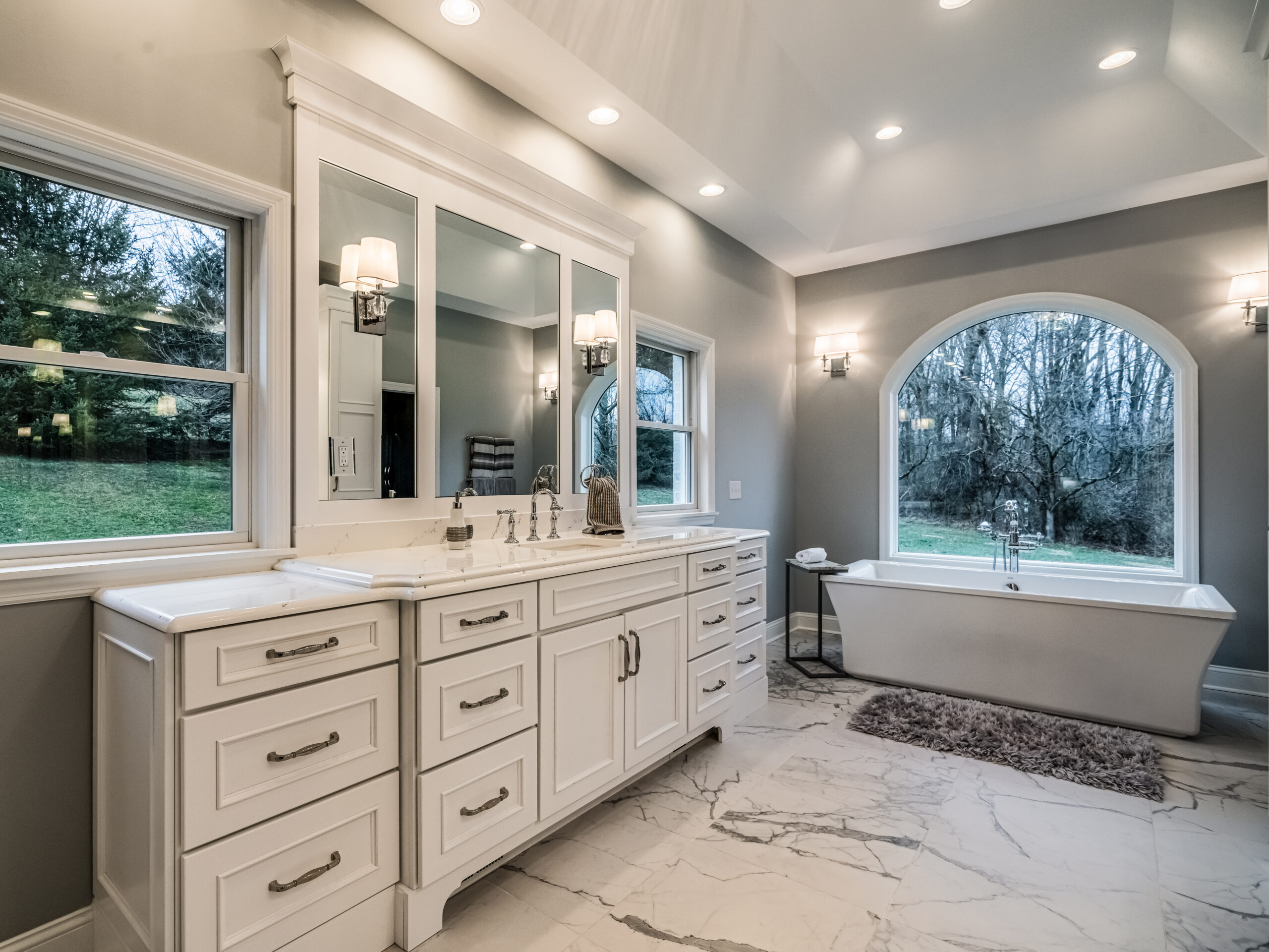 Master bath: double vanity, freestanding tub, arched window, built by Premier Custom Builders